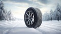 copy space, stockphoto, Brand new winter car tires showcased against a snowy road backdrop. Wintertire in a winte landscape