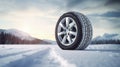 copy space, stockphoto, Brand new winter car tires showcased against a snowy road backdrop. Wintertire in a winte landscape