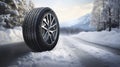 copy space, stockphoto, Brand new winter car tires showcased against a snowy road backdrop. Wintertire in a winte landscape