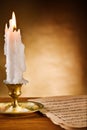 Copy space view on the ablaze candle and old notes Royalty Free Stock Photo