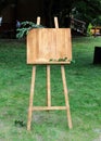 Wooden easel with a board.Copy space, your text here
