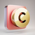 Copyright icon. Golden Copyright symbol on red matte gold plate