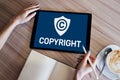 Copyright icon on screen. Patent Law and Intellectual Property. Business, Internet and Technology Concept. Royalty Free Stock Photo