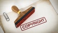 Copyright stamp standing on documents. 3D illustration Royalty Free Stock Photo