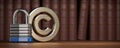 Copyright symbol with padlock on law books background. Intellectual property protection concept Royalty Free Stock Photo