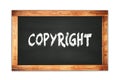 COPYRIGHT text written on wooden frame school blackboard