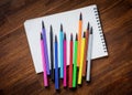 Copyspace blank sheet of white paper covered with multiple colorful felt pen markers Royalty Free Stock Photo