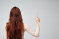 Copyspace with caucasian woman with long red hair from the back Royalty Free Stock Photo