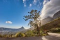 Copyspace and scenic landscape of a curved road and cloudy blue sky by Table Mountain in Cape Town, Western Cape. Bright