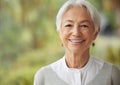 Copyspace with smiling senior woman. Portrait of a happy lady with grey hair enjoying a carefree retirement. Face of Royalty Free Stock Photo