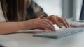 Copywriter typing keyboard text at table closeup. Programmer writing pc code