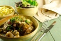 Coq au vin with salad and noodles