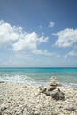 Coral Beach with stacked rocks and a view of the ocean. Royalty Free Stock Photo