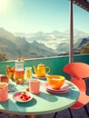 Coral chair and turquoise table with morning breakfast on beautiful terrace with stunning mountain view. Summer holiday or