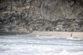 Coral cliffs on the coast with sand and waves