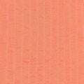 Coral color textile background from stitched silk