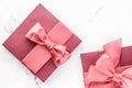 Coral gift box with silk bow on marble background, girl baby shower present and glamour fashion gift for luxury beauty brand, Royalty Free Stock Photo