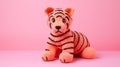 Coral Knitted Tiger Toy On Pink Background