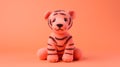 Coral Knitted Tiger Toy On Pink Background