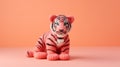 Coral Knitted Tiger Toy On Pink Background