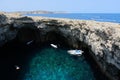 Coral lagoon with an inland sea with an arch of a collapsed cave in Mellieha, Malta
