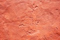 Coral orange abstract grunge texture background for design. Painted old damaged rough wall surface. Royalty Free Stock Photo