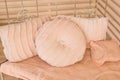 Coral pink pillows. Stylish armchair with pillow