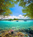 Coral reef in background of tropical desert island Royalty Free Stock Photo