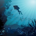 Coral reef with fish and silhouette of diver Royalty Free Stock Photo