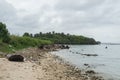 Coral rocks and small stones in the ocean on the beach at the tropical island Royalty Free Stock Photo