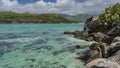 Corals are visible through the clear turquoise ocean water Royalty Free Stock Photo