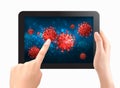 Coranavirus concept background. Two hands touch screen of tablet with virus COVID - 19 molecules