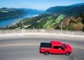 Red car driving along a scenic route near Crown Point Vista House in Columbia River Gorge Royalty Free Stock Photo