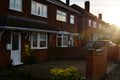 Corby, England. November 13 - Brick village traditional houses at sunset.