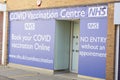 Corby, England 01.04. 2021 vaccination centre entrance building, blue and white sign outdoor