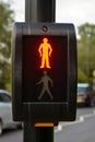 Corby, U.K., june 20, 2019 - push button wait for signal traffic light control with bright stop man illuminated at pedestrian