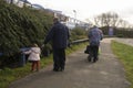 Corby, U.K, 19 March 2019 - Grandparents walking with their girl nephew, enjoying each other& x27;s company. Pension couple