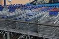 Corby, U.K, 19 March 2019 - A long row of shopping trolleys carts at LIDL Shop, outside of a large supermarket Royalty Free Stock Photo