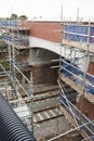 Corby, United Kingdom - August 29, 2018: old classical brik english building. Carried out scheduled repair work on the reconstruct