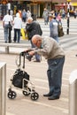 Corby, United Kingdom - august 28, 2018: An Old man using mobility aid standing walking basing on walker conceptual togetherness h Royalty Free Stock Photo