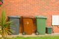 Corby, United Kingdom, 20 june 02019 - wheelie bin in front of a house, brick wall