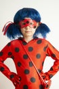 Corby, United Kingdom. March 12, 2019 - little girl in Ladybug Myraculous cosplay costume. Superhero ladybug with blue twig,