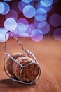 Corck for champagne on wooden table and blurred background Royalty Free Stock Photo
