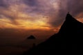 Corcovado mountain Christ the Redeemer standing in golden sunset clouds Rio de Janeiro Brazil. Royalty Free Stock Photo
