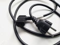 Cord of connection of power supply of household appliances of black color with grounding
