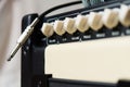 Cord jack cable to the electric guitar amplifier, combo amplifier and microphone. Instrument cable and guitar cabinet. Royalty Free Stock Photo