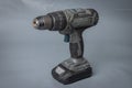 Cordless battery powered drill or screwdriver. Practical machine without electric cable for drilling and screwing in screws. Royalty Free Stock Photo