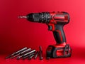 Cordless drill with drill bits. High-quality close-up shot. Studio light Royalty Free Stock Photo