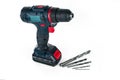 Cordless drill and a set of different drills. Royalty Free Stock Photo