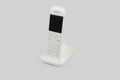 Cordless phone on stand and on a white background Royalty Free Stock Photo